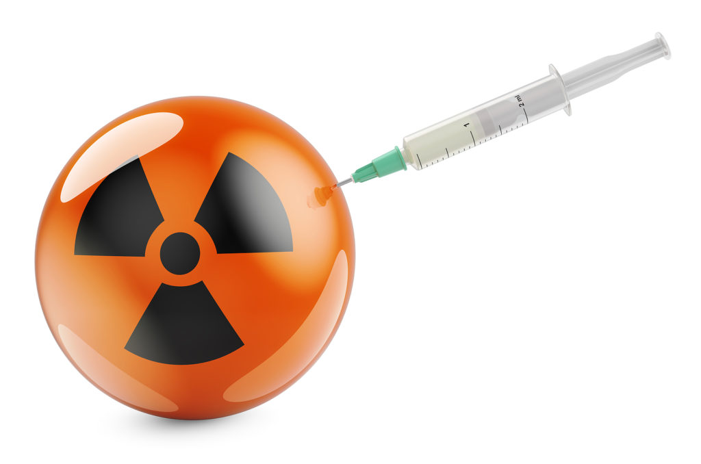 Syringe with radiation symbol flag