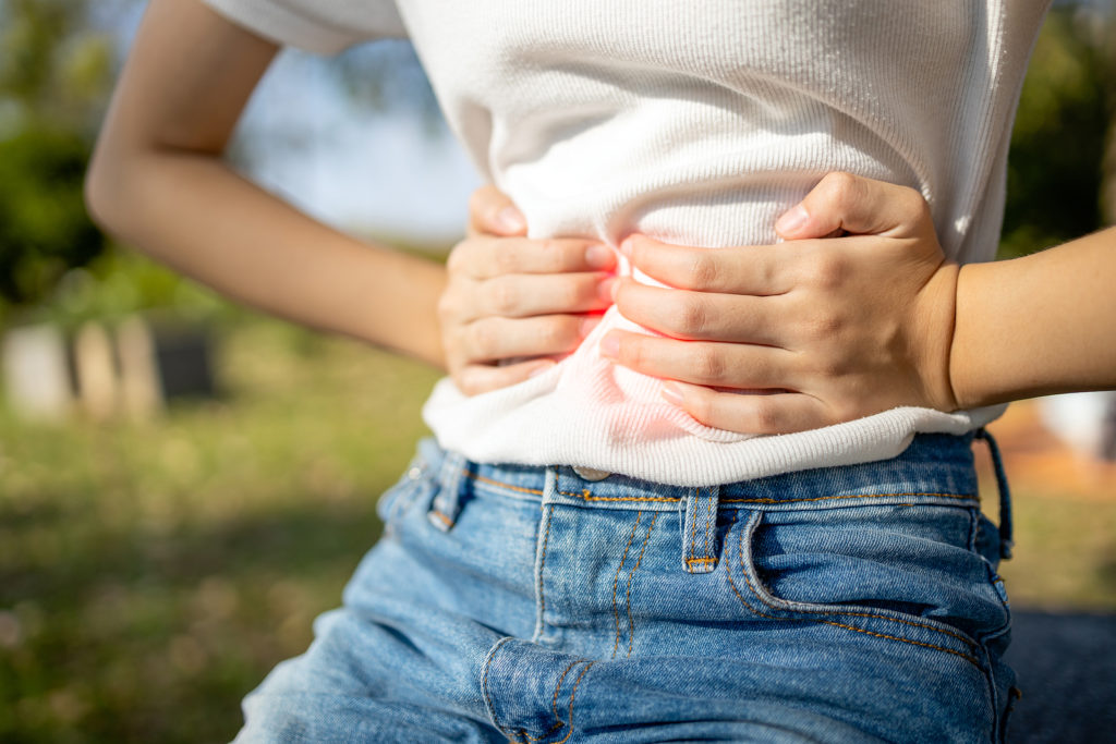 Asian Child Girl With Stomach Ache,woman Having Aching Belly Wit